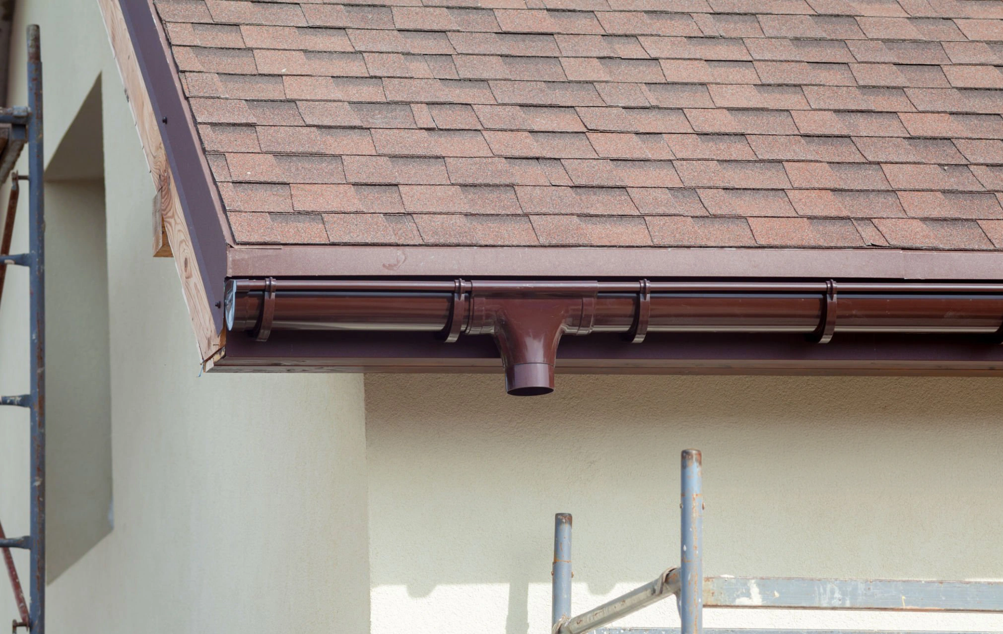 Gutter installation along a property roofline