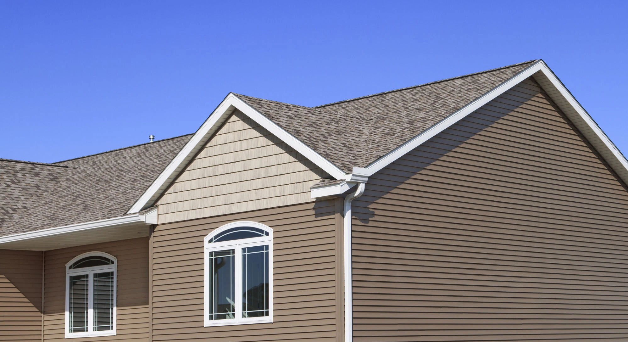 Replacement siding installed across an exterior wall